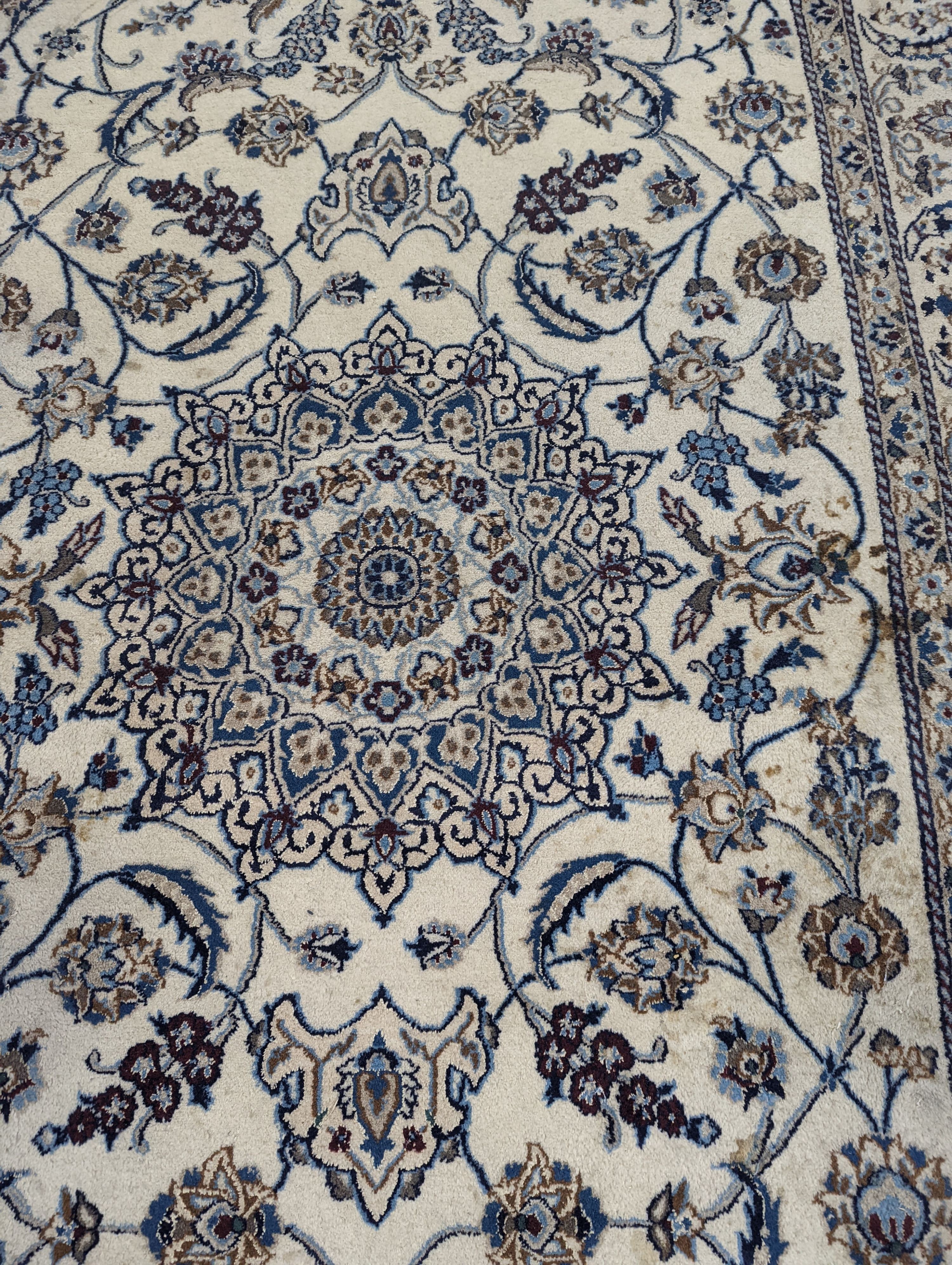 An ivory ground Nain carpet, 290 x 205cm